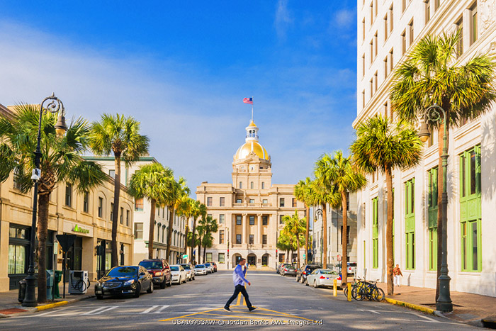 USA, Georgia, Savannah, Man walking under the town hall