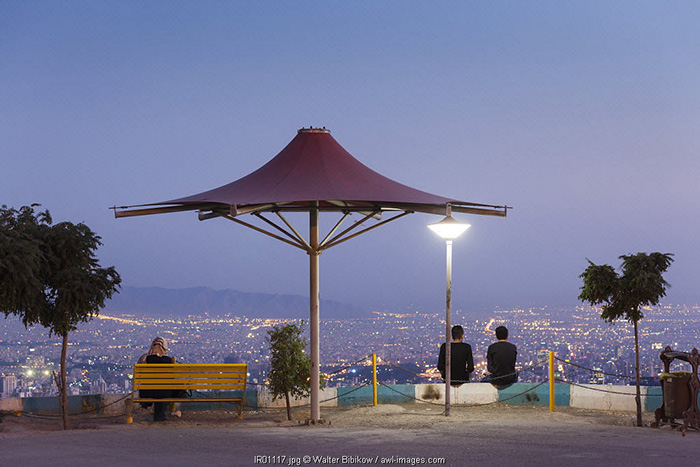 Iran, Tehran, visitors to the Roof of Iran Park above the city skyline